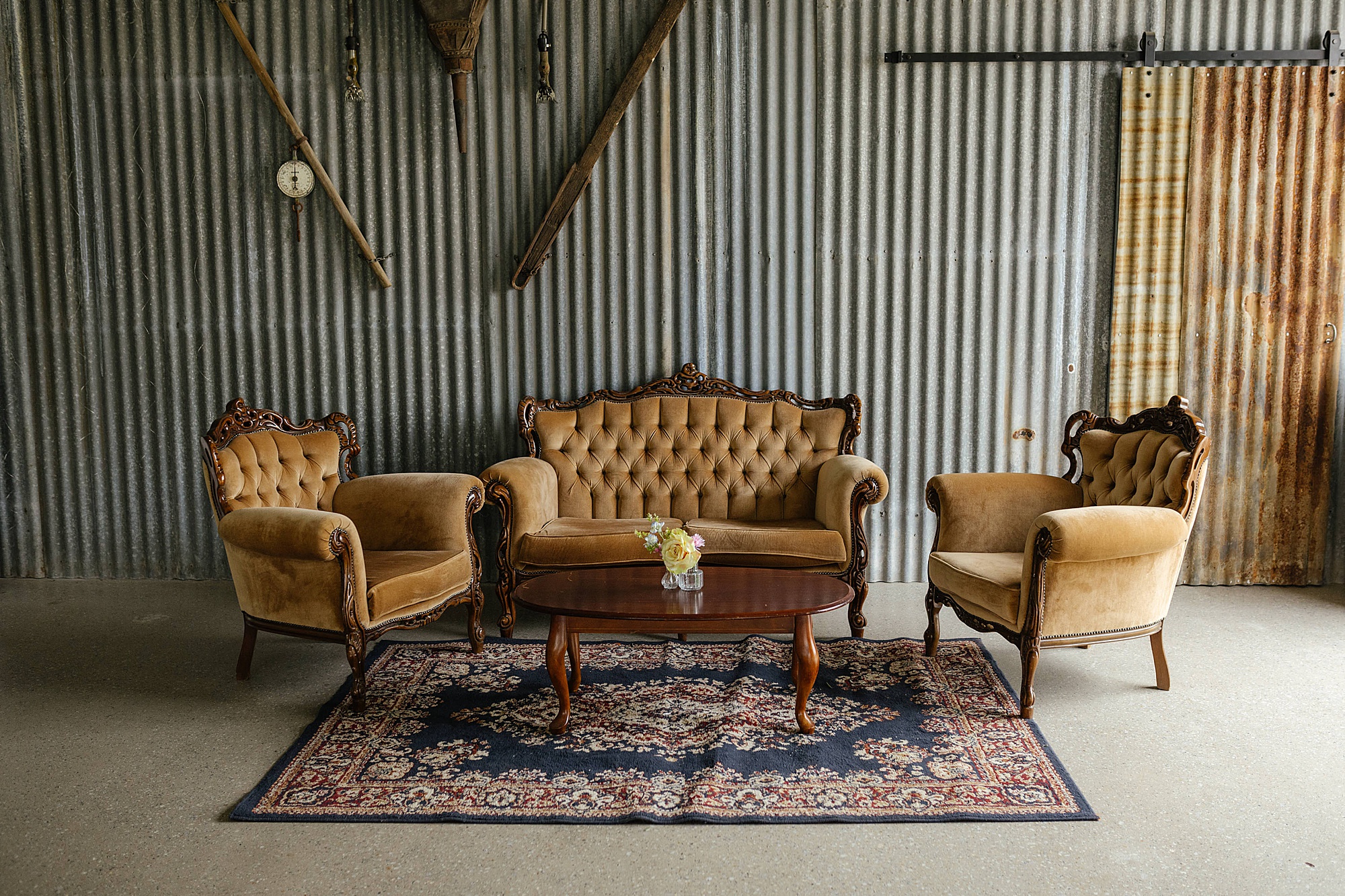 Vintage living room couch setup at wedding reception at Charm Lodge.